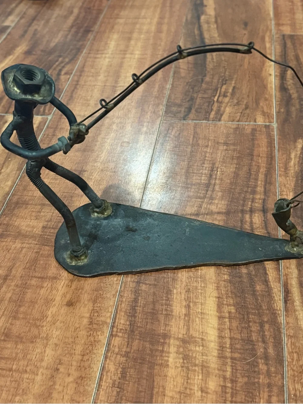 Industrial scrap metal sculpture fishing motif